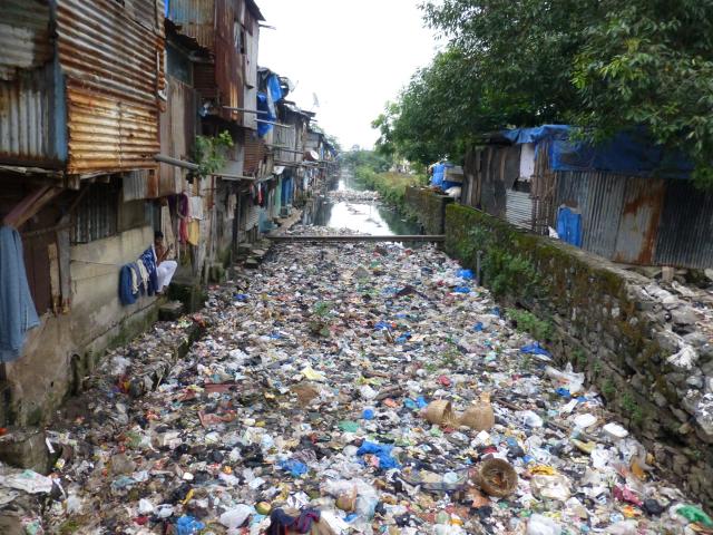 Convergence of human and solid waste in a stormwater drain in Mumbai, India (Photo by Giacomo Galli/ IRC)