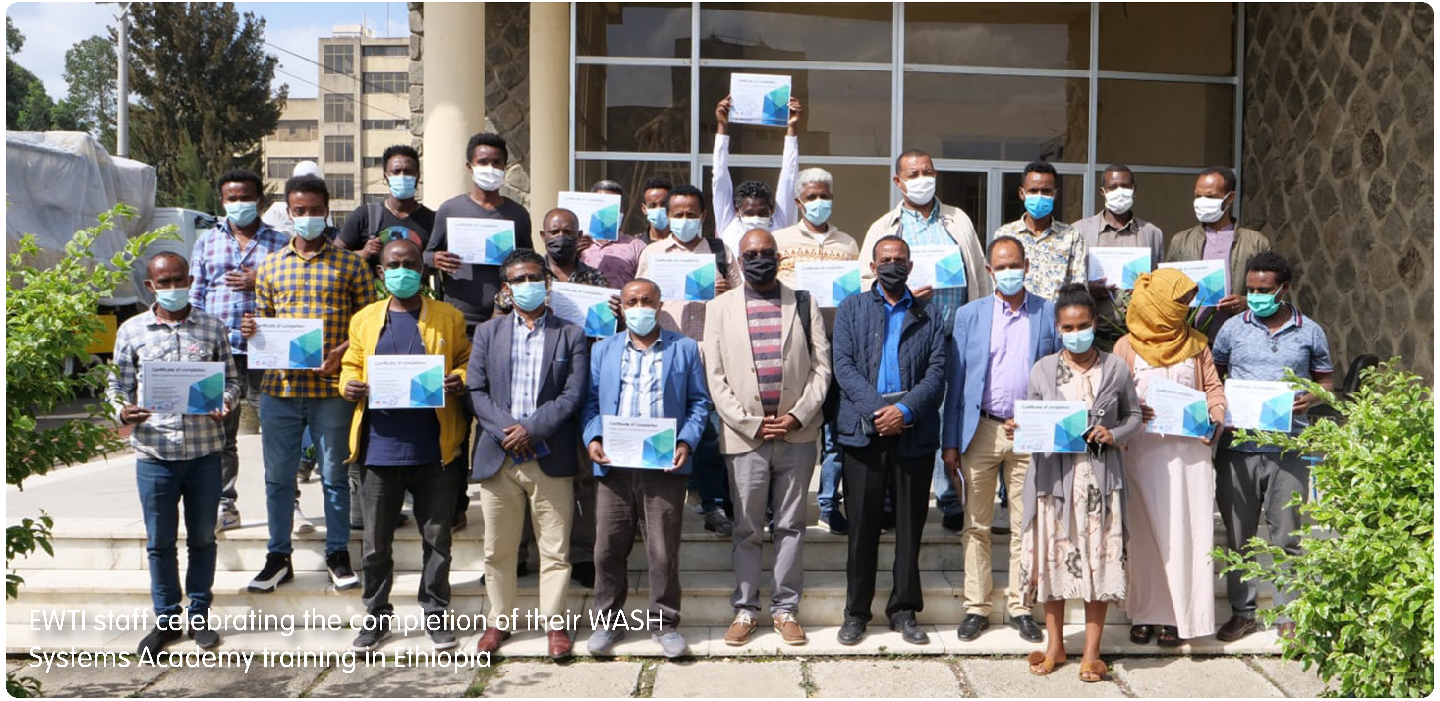 EWTI staff celebrating the completion of their WASH Systems Academy training in Ethiopia