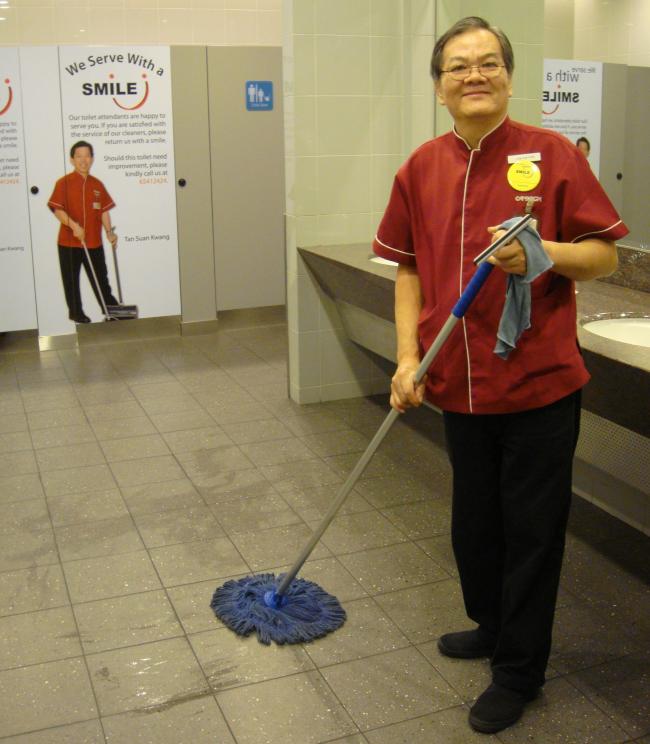 We Serve with a Smile. Photo: World Toilet Organization