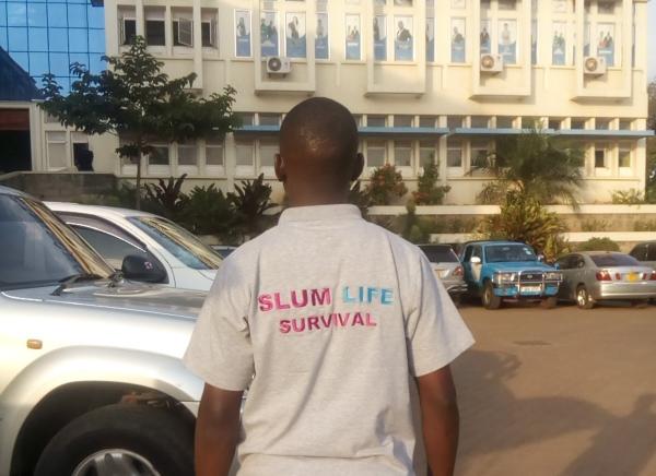 Kenneth Kavulu with Slum Life Survival shirt