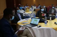 Multi-stakeholder platform meeting in Ethiopia, participant on the left is using Telegram on his computer