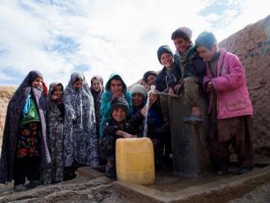 Children at a water pump in Afghanistan, photo by Rosanna Keam