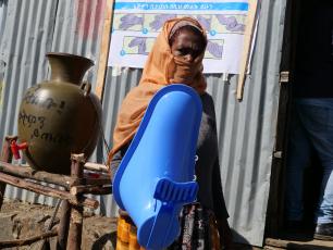 Woman at shop for toilet parts in Ethiopia