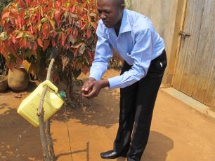 Using a tippy tap in Rwanda