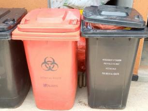 Colour-coded bins outside a healthcare facility in Kabarole, Uganda