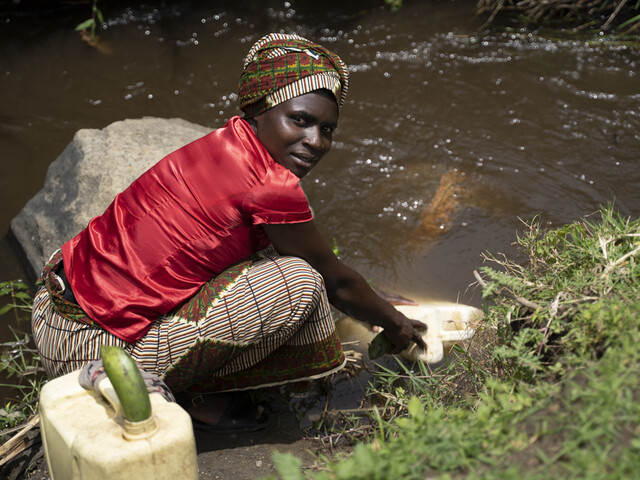 Fetching water from the river, Uganda