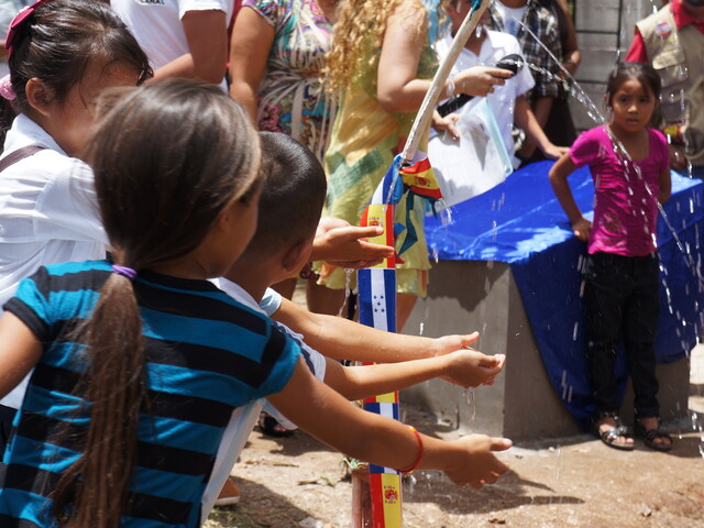 Children playing with water in Honduras
