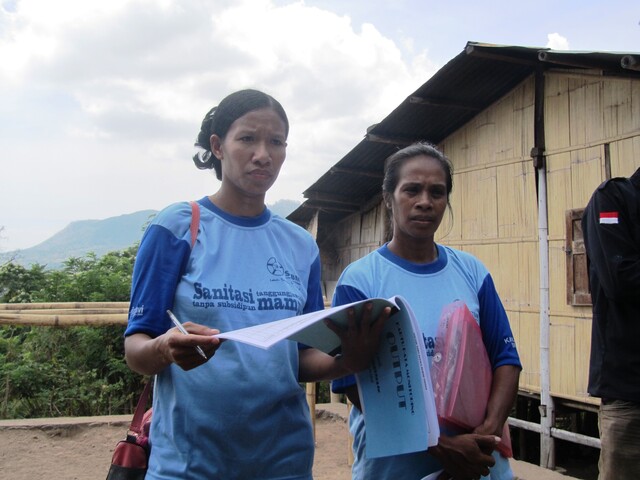 Ladies monitoring sanitation in Indonesian village