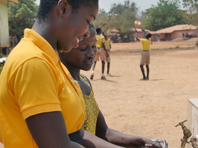 Girls from Kenyasi No2 Model Basic School washing hands