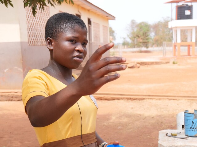 Kenyasi schoolgirl explaining the benefits of water 
