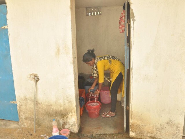 Woman from Odisha washing clothes