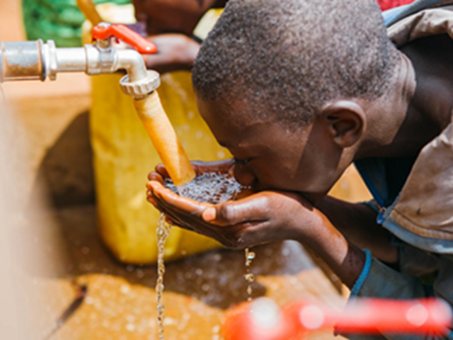 Boy drinking water - Rwanda
