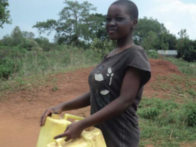Woman fetching water in Uganda