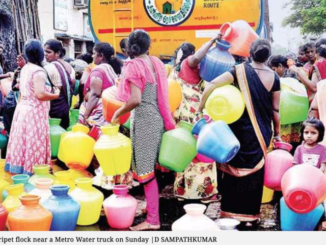 Residents of Chintadripet flock around a water truck