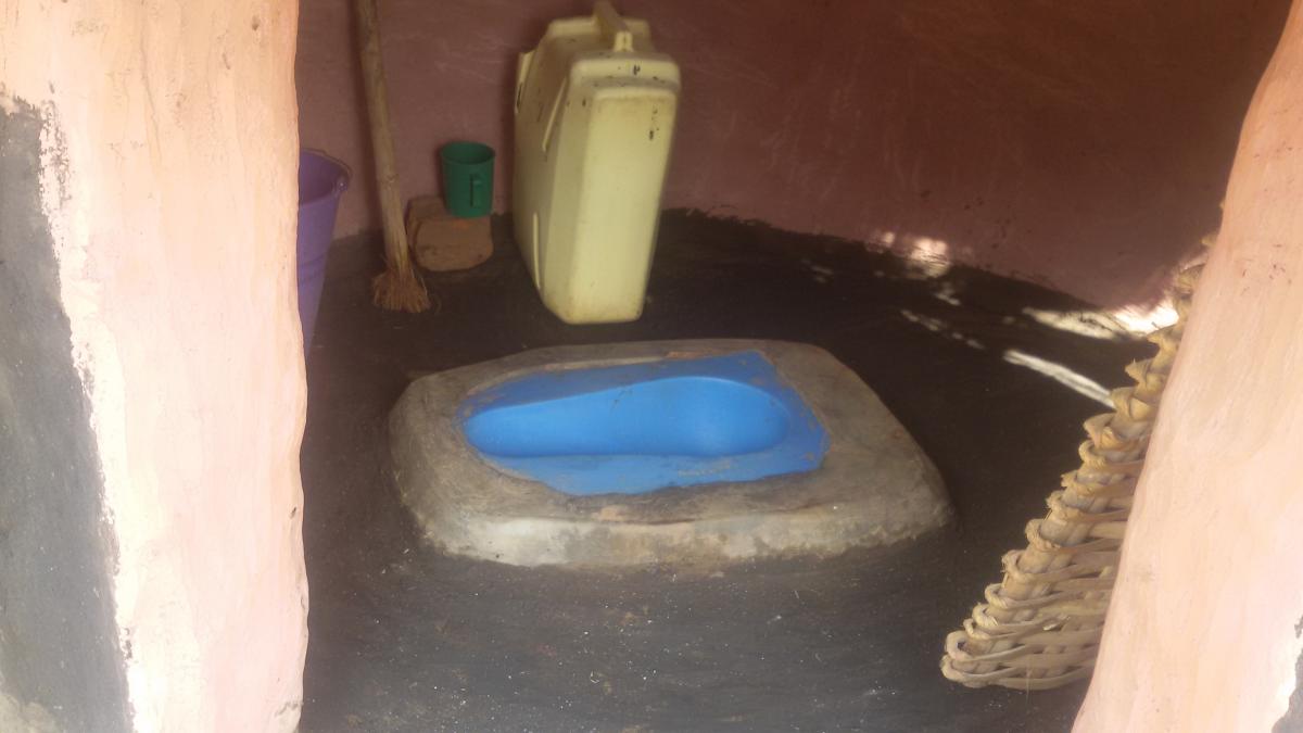 A clean latrine with a satopan
