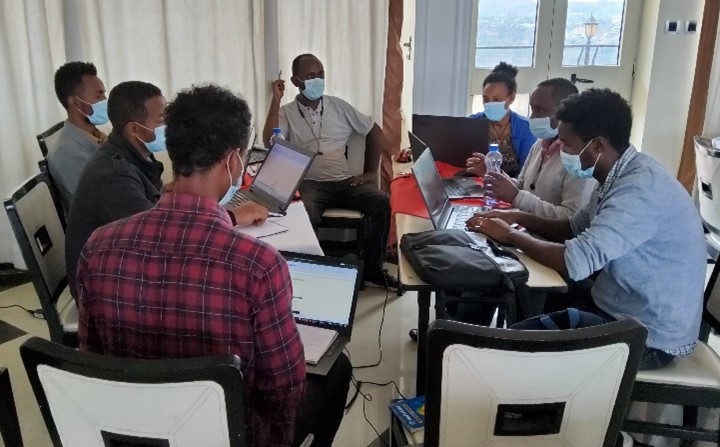 Participants in a circle during group discussion