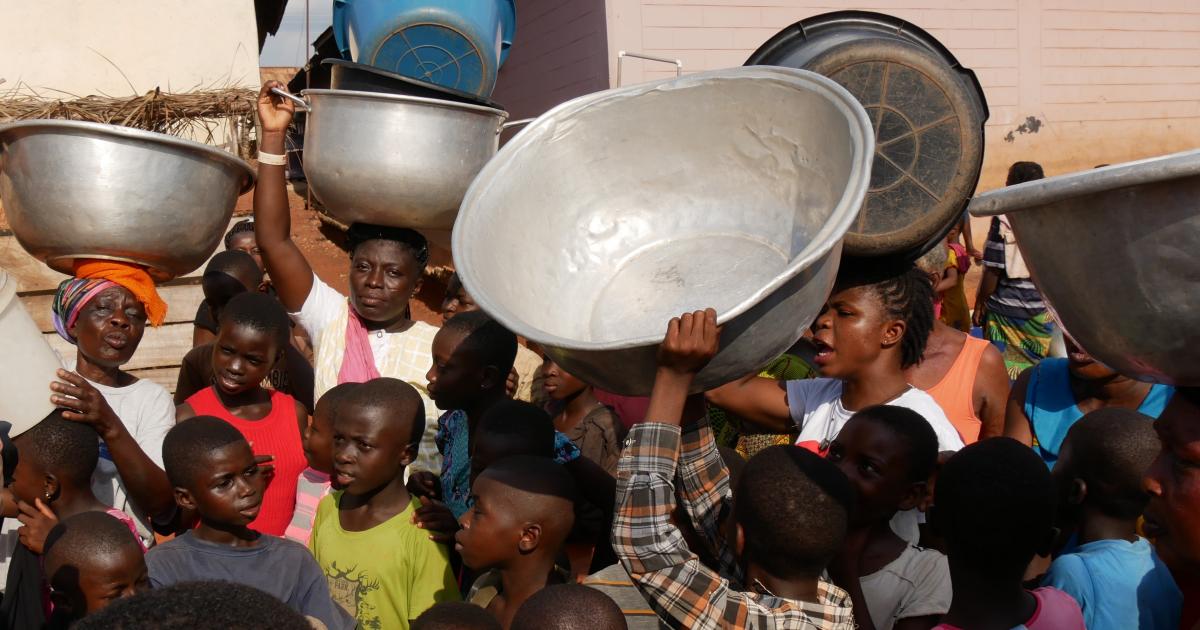 People waiting at a pump in Wamahinso