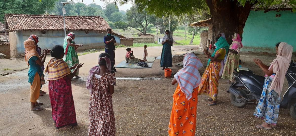 Handwashing instruction for young women and girls (photo courtesy of NEEDS)