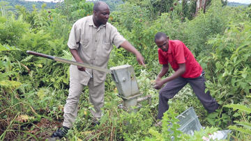 Vincent Nyakoojo (left), chairperson of the Kabarole District Hand Pump Mechanics Association repairing an abandoned pump in Bueheesi sub-county with fellow mechanic Wilson Kutambaki.